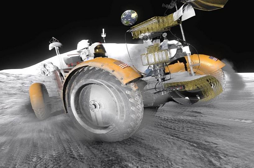 A moon buggy driving on the moon.
