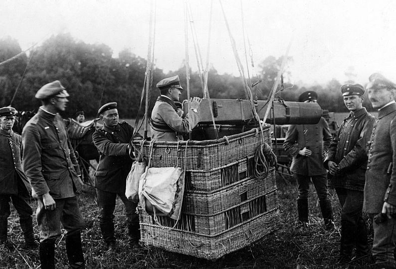An aerial observer in a still stationary observation balloon with a camera (focal length of 120 cm). 