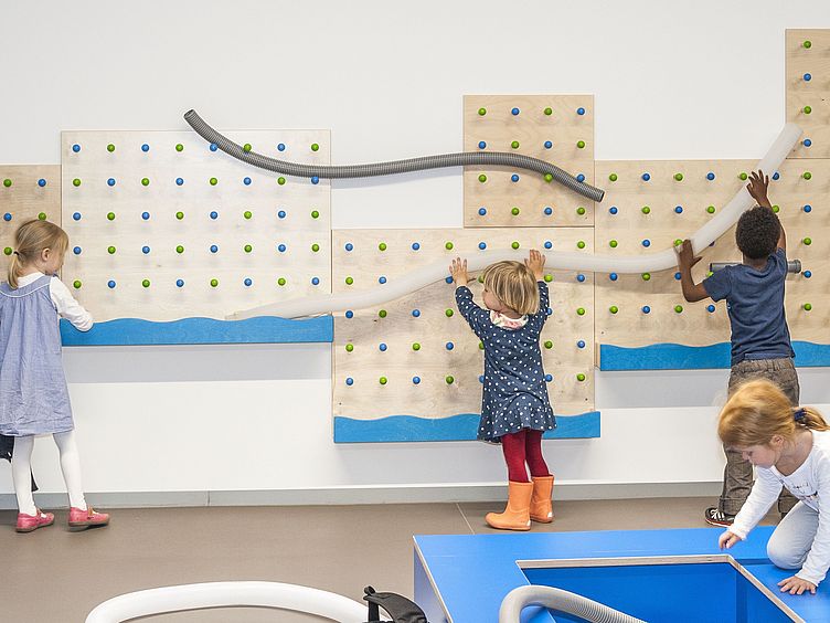 Marble Run Children playing in front of the marble run