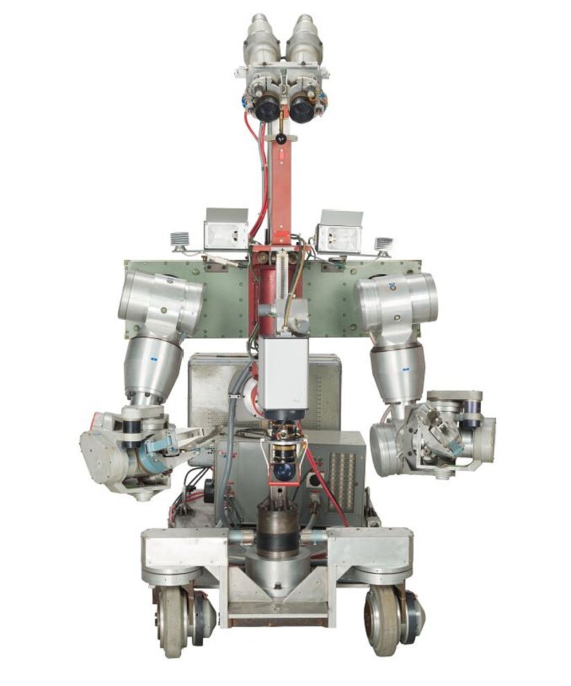 Zu sehen ist der Roboter Syntelman, der eine fast menschliche Anatomie hat mit einer Art Armen, Beinen und Augen