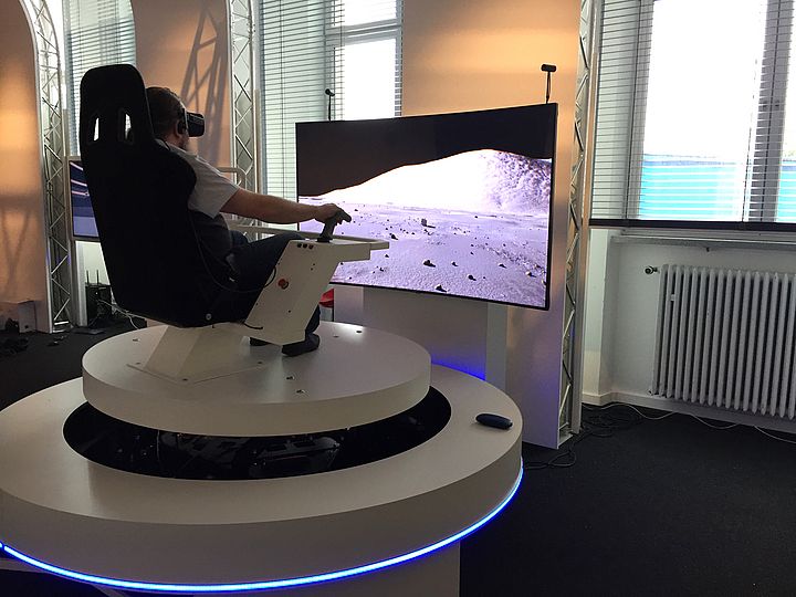 A guy testing the driving simulator.