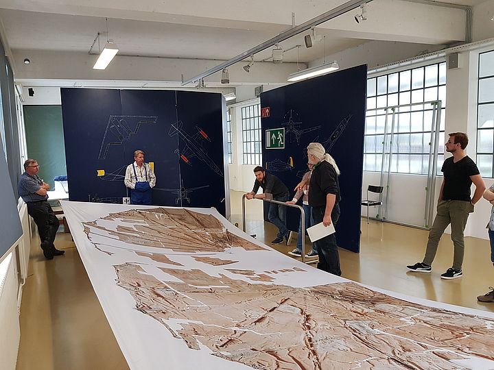 Curators planning the presentation of the glider together with their colleagues from the aviation workshop and conservation science department