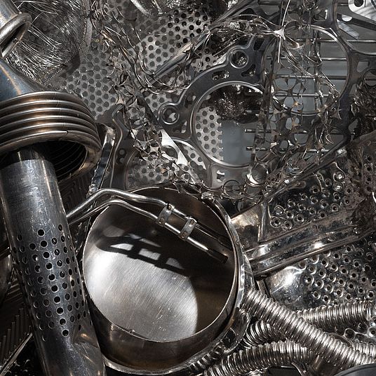 Pieces of recycled stainless steel joined together as a work of art.