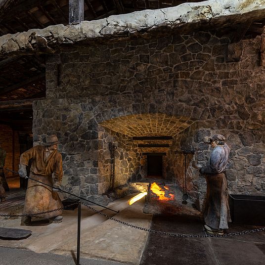 Near life-size diorama. Iron production at a blast furnace in the Siegerland region of Germany in 1810.